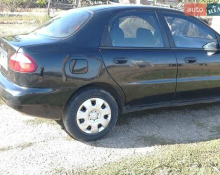 Черный Дэу Ланос, объемом двигателя 1.6 л и пробегом 271 тыс. км за 2000 $, фото 4 на Automoto.ua