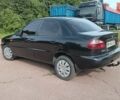 Черный Дэу Ланос, объемом двигателя 1.5 л и пробегом 280 тыс. км за 2050 $, фото 2 на Automoto.ua