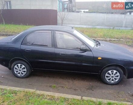 Черный Дэу Ланос, объемом двигателя 1.5 л и пробегом 230 тыс. км за 2350 $, фото 1 на Automoto.ua