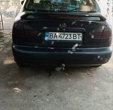 Черный Дэу Ланос, объемом двигателя 1.5 л и пробегом 236 тыс. км за 2300 $, фото 7 на Automoto.ua