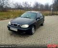 Черный Дэу Ланос, объемом двигателя 1.6 л и пробегом 200 тыс. км за 1600 $, фото 1 на Automoto.ua