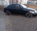 Черный Дэу Ланос, объемом двигателя 1.5 л и пробегом 173 тыс. км за 1500 $, фото 1 на Automoto.ua