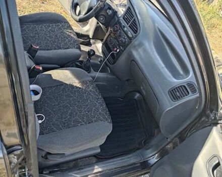 Черный Дэу Ланос, объемом двигателя 1.6 л и пробегом 271 тыс. км за 2000 $, фото 2 на Automoto.ua