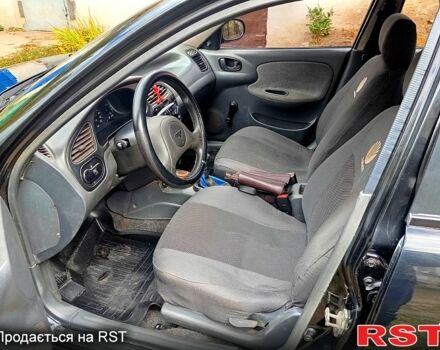 Черный Дэу Ланос, объемом двигателя 1.5 л и пробегом 337 тыс. км за 3000 $, фото 1 на Automoto.ua