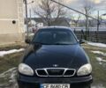 Черный Дэу Ланос, объемом двигателя 1.5 л и пробегом 290 тыс. км за 1500 $, фото 1 на Automoto.ua