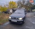 Черный Дэу Ланос, объемом двигателя 1.5 л и пробегом 265 тыс. км за 2000 $, фото 1 на Automoto.ua