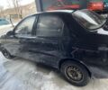 Черный Дэу Ланос, объемом двигателя 1.5 л и пробегом 235 тыс. км за 2000 $, фото 2 на Automoto.ua