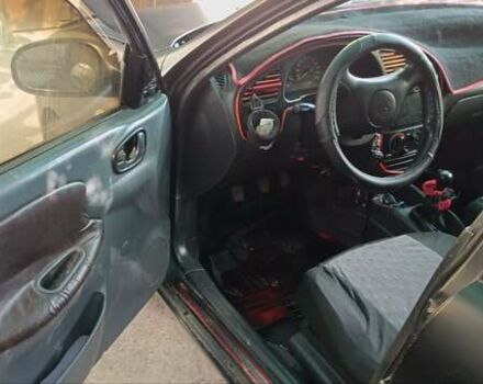 Черный Дэу Ланос, объемом двигателя 1.5 л и пробегом 236 тыс. км за 2300 $, фото 1 на Automoto.ua