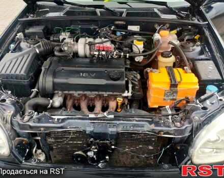 Черный Дэу Ланос, объемом двигателя 1.6 л и пробегом 200 тыс. км за 1600 $, фото 7 на Automoto.ua