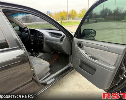 Чорний Деу Ланос, об'ємом двигуна 1.5 л та пробігом 240 тис. км за 2750 $, фото 7 на Automoto.ua