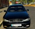 Черный Дэу Ланос, объемом двигателя 1.5 л и пробегом 320 тыс. км за 1900 $, фото 1 на Automoto.ua