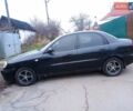 Черный Дэу Ланос, объемом двигателя 1.5 л и пробегом 141 тыс. км за 1700 $, фото 1 на Automoto.ua