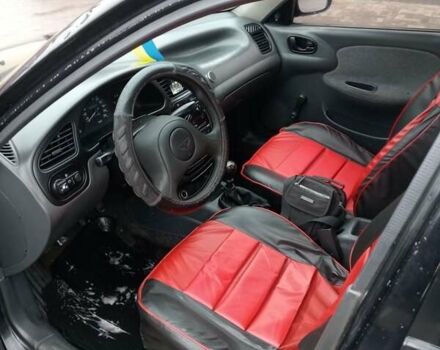 Черный Дэу Ланос, объемом двигателя 1.5 л и пробегом 224 тыс. км за 1499 $, фото 11 на Automoto.ua