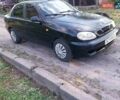 Черный Дэу Ланос, объемом двигателя 1.5 л и пробегом 300 тыс. км за 880 $, фото 1 на Automoto.ua