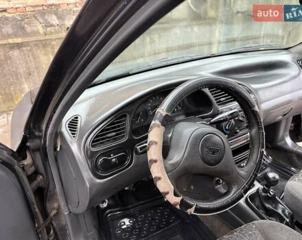 Черный Дэу Ланос, объемом двигателя 0 л и пробегом 150 тыс. км за 1250 $, фото 11 на Automoto.ua