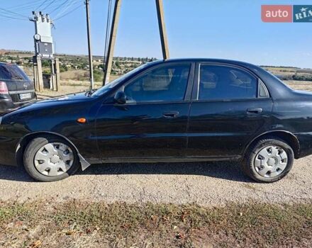 Черный Дэу Ланос, объемом двигателя 1.6 л и пробегом 271 тыс. км за 2000 $, фото 6 на Automoto.ua