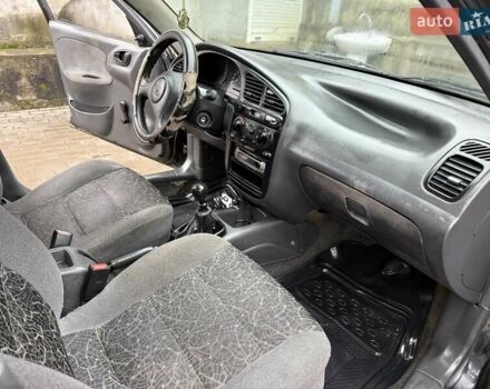 Черный Дэу Ланос, объемом двигателя 0 л и пробегом 150 тыс. км за 1250 $, фото 1 на Automoto.ua