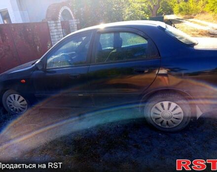 Черный Дэу Ланос, объемом двигателя 1.6 л и пробегом 380 тыс. км за 2300 $, фото 4 на Automoto.ua