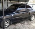 Черный Дэу Ланос, объемом двигателя 1.39 л и пробегом 150 тыс. км за 1950 $, фото 1 на Automoto.ua