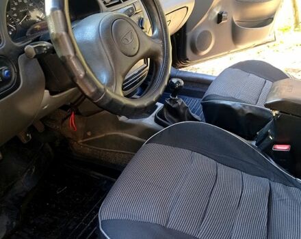 Черный Дэу Ланос, объемом двигателя 1.5 л и пробегом 365 тыс. км за 2000 $, фото 5 на Automoto.ua