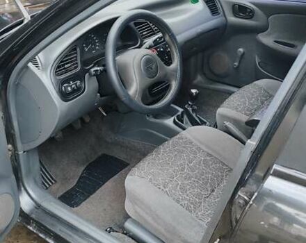 Черный Дэу Ланос, объемом двигателя 1.5 л и пробегом 130 тыс. км за 2700 $, фото 5 на Automoto.ua