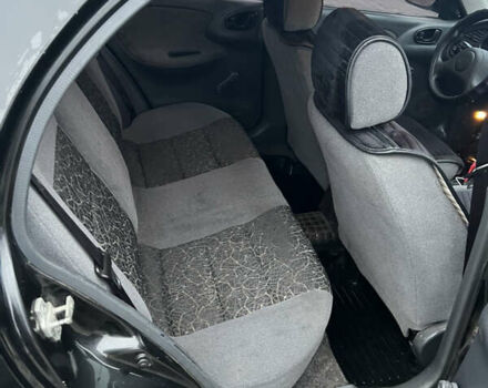 Черный Дэу Ланос, объемом двигателя 1.5 л и пробегом 161 тыс. км за 1950 $, фото 9 на Automoto.ua