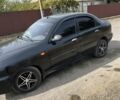Черный Дэу Ланос, объемом двигателя 1.5 л и пробегом 191 тыс. км за 2550 $, фото 1 на Automoto.ua