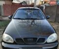 Черный Дэу Ланос, объемом двигателя 1.6 л и пробегом 238 тыс. км за 2500 $, фото 1 на Automoto.ua