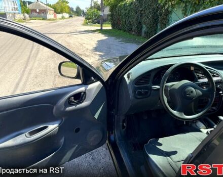 Черный Дэу Ланос, объемом двигателя 1.5 л и пробегом 150 тыс. км за 1150 $, фото 3 на Automoto.ua