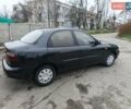 Черный Дэу Ланос, объемом двигателя 1.5 л и пробегом 240 тыс. км за 1800 $, фото 7 на Automoto.ua