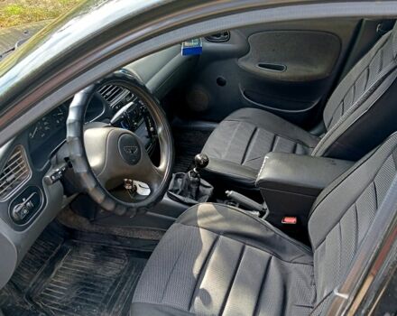 Черный Дэу Ланос, объемом двигателя 1.5 л и пробегом 213 тыс. км за 2400 $, фото 5 на Automoto.ua