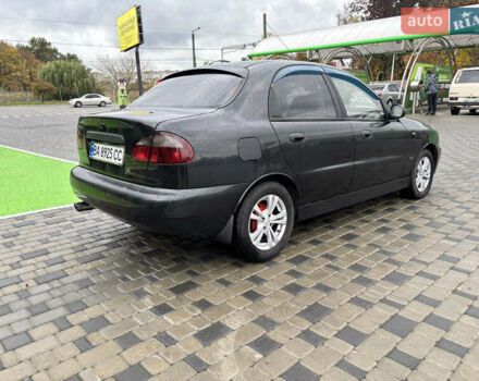 Черный Дэу Ланос, объемом двигателя 1.6 л и пробегом 270 тыс. км за 2900 $, фото 6 на Automoto.ua
