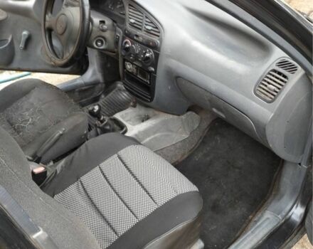 Черный Дэу Ланос, объемом двигателя 1.4 л и пробегом 1 тыс. км за 2000 $, фото 1 на Automoto.ua