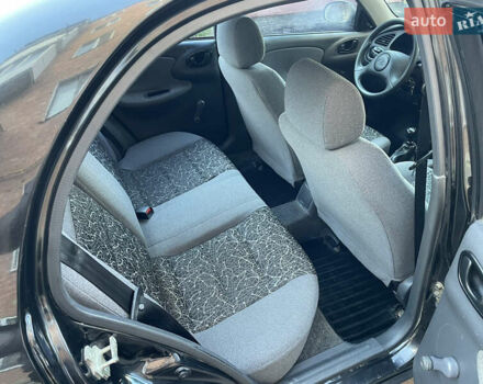 Черный Дэу Ланос, объемом двигателя 1.4 л и пробегом 233 тыс. км за 2500 $, фото 28 на Automoto.ua