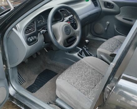 Черный Дэу Ланос, объемом двигателя 1.5 л и пробегом 130 тыс. км за 2700 $, фото 5 на Automoto.ua