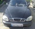 Черный Дэу Ланос, объемом двигателя 1.6 л и пробегом 300 тыс. км за 1950 $, фото 1 на Automoto.ua
