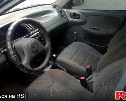 Черный Дэу Ланос, объемом двигателя 1.5 л и пробегом 276 тыс. км за 2000 $, фото 5 на Automoto.ua