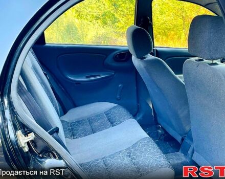 Черный Дэу Ланос, объемом двигателя 1.4 л и пробегом 303 тыс. км за 1199 $, фото 7 на Automoto.ua