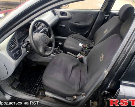 Черный Дэу Ланос, объемом двигателя 1.5 л и пробегом 220 тыс. км за 1000 $, фото 6 на Automoto.ua