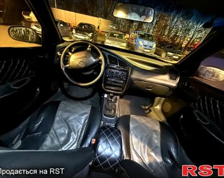Черный Дэу Ланос, объемом двигателя 1.5 л и пробегом 292 тыс. км за 2300 $, фото 6 на Automoto.ua
