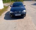 Черный Дэу Ланос, объемом двигателя 1.4 л и пробегом 200 тыс. км за 1600 $, фото 1 на Automoto.ua