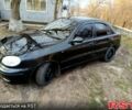 Черный Дэу Ланос, объемом двигателя 1.5 л и пробегом 280 тыс. км за 2100 $, фото 1 на Automoto.ua