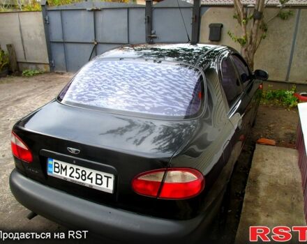 Черный Дэу Ланос, объемом двигателя 1.5 л и пробегом 230 тыс. км за 2000 $, фото 2 на Automoto.ua