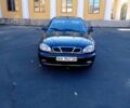 Черный Дэу Ланос, объемом двигателя 1.5 л и пробегом 365 тыс. км за 2000 $, фото 1 на Automoto.ua