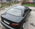 Черный Дэу Ланос, объемом двигателя 1.5 л и пробегом 240 тыс. км за 1800 $, фото 4 на Automoto.ua
