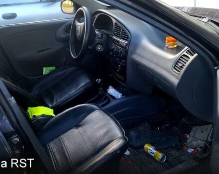 Черный Дэу Ланос, объемом двигателя 1.6 л и пробегом 269 тыс. км за 1300 $, фото 3 на Automoto.ua