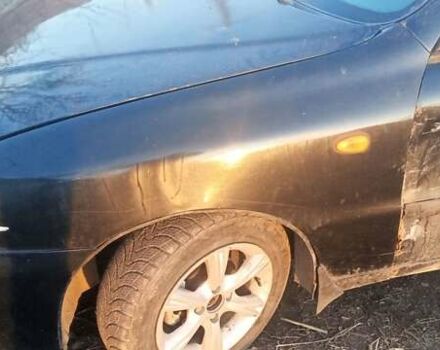 Черный Дэу Ланос, объемом двигателя 1.5 л и пробегом 238 тыс. км за 1950 $, фото 4 на Automoto.ua