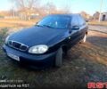 Черный Дэу Ланос, объемом двигателя 1.4 л и пробегом 222 тыс. км за 1790 $, фото 1 на Automoto.ua