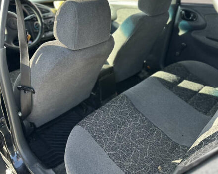 Чорний Деу Ланос, об'ємом двигуна 1.5 л та пробігом 150 тис. км за 1850 $, фото 2 на Automoto.ua