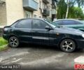 Черный Дэу Ланос, объемом двигателя 1.5 л и пробегом 140 тыс. км за 1999 $, фото 1 на Automoto.ua